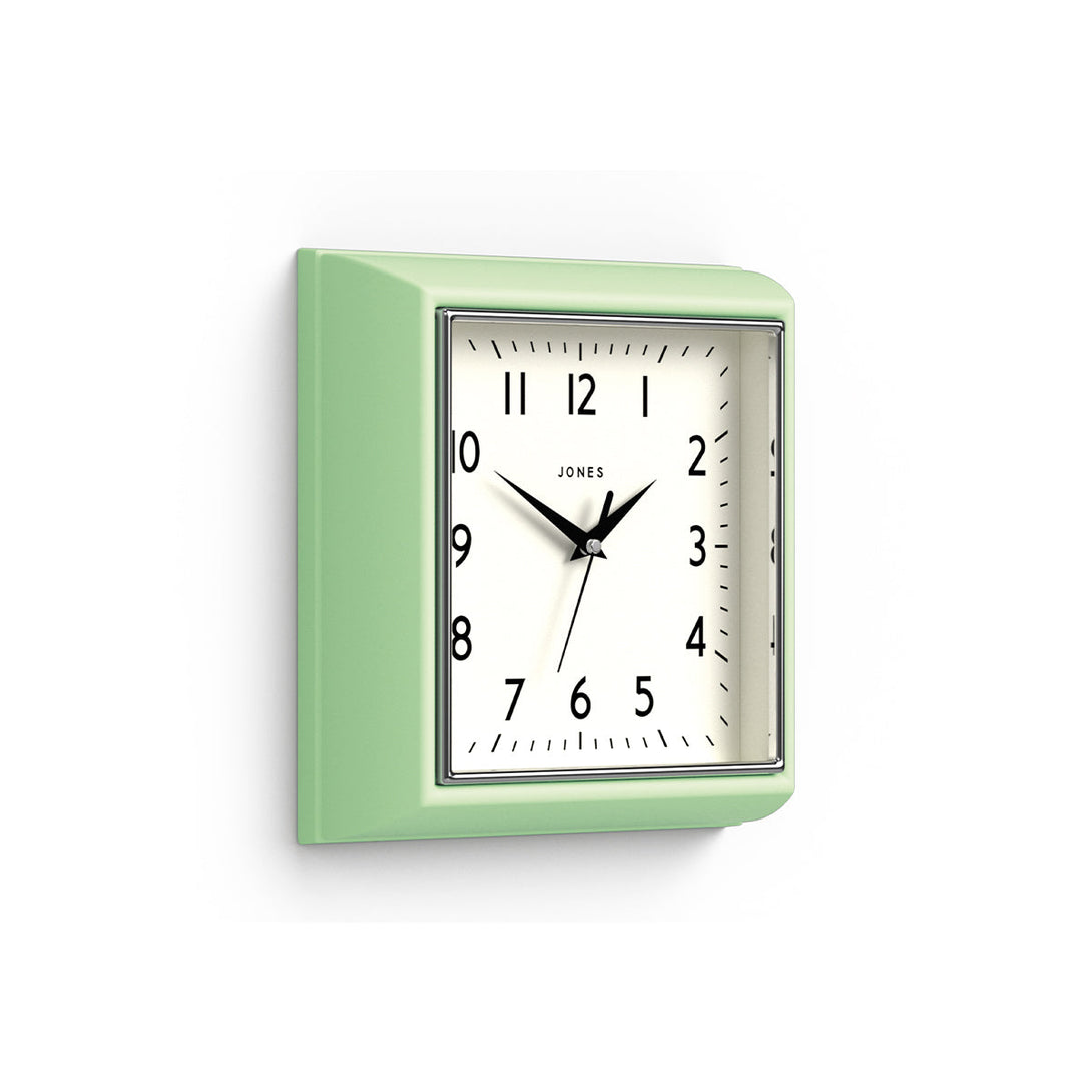 Skew - Mustard wall clock by Jones Clocks in mint green with a square retro style case and a contemporary dial - JMUST741NM
