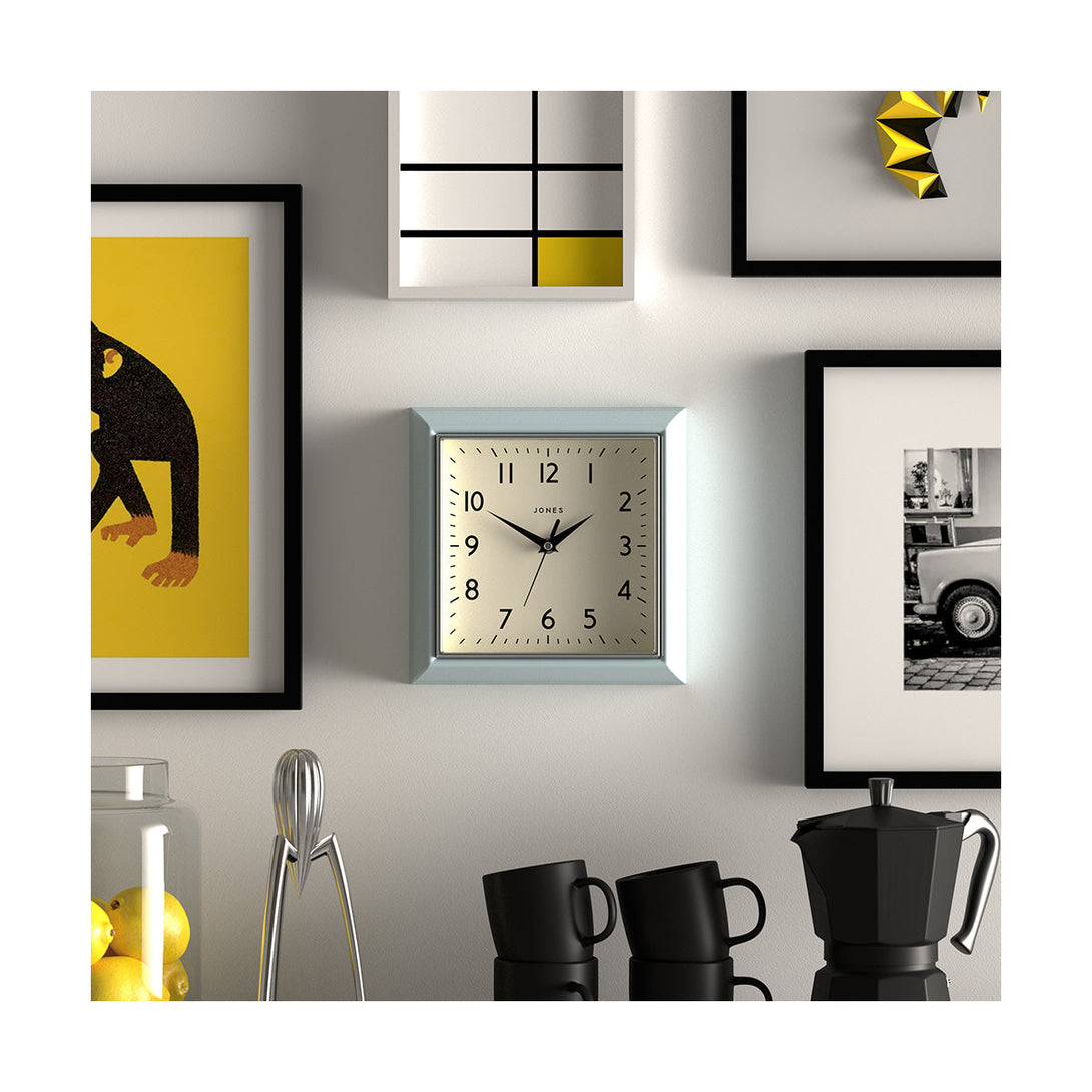 Style shot - Mustard small square wall clock by Jones Clocks in Blue with an Arabic dial and metal hands - JMUST741CBL