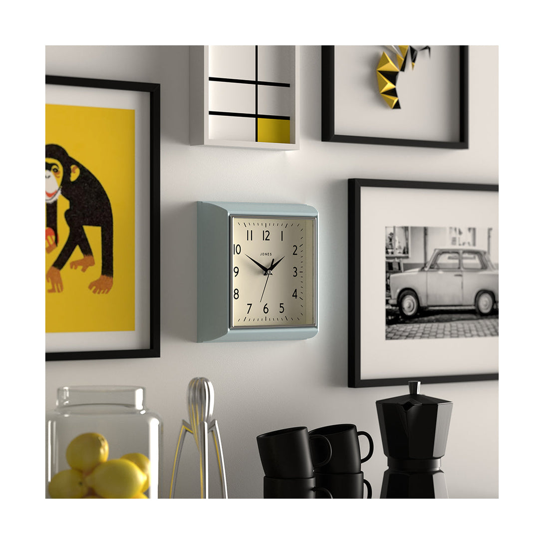 Style shot skew - Mustard small square wall clock by Jones Clocks in Blue with an Arabic dial and metal hands - JMUST741CBL