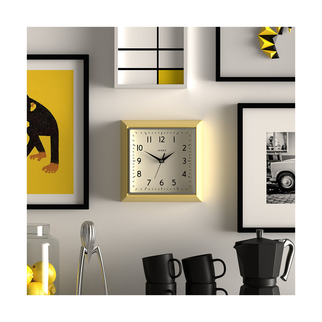 Style shot - Mustard small square wall clock by Jones Clocks in yellow with an Arabic dial and metal hands - JMUST741CHYt