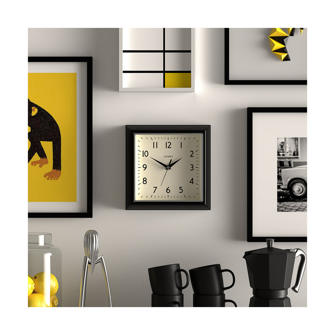 Style shot - Small square Mustard wall clock by Jones Clocks in Black with a Arabic dial and metal hands - JMUST741K