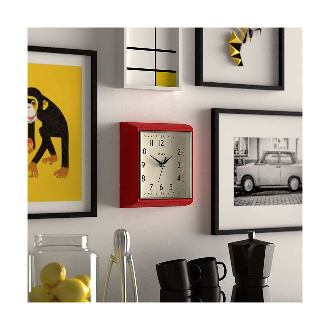 Skew style shot - Mustard wall clock by Jones Clocks in red with a square retro style case and a contemporary dial - JMUST741R