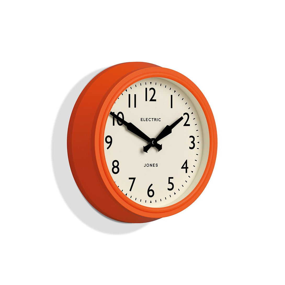 Skew - Telecom wall clock by Jones Clocks. A mid-century modern orange case, bold Arabic dial, and retro propelling hands - JTCOM27PO