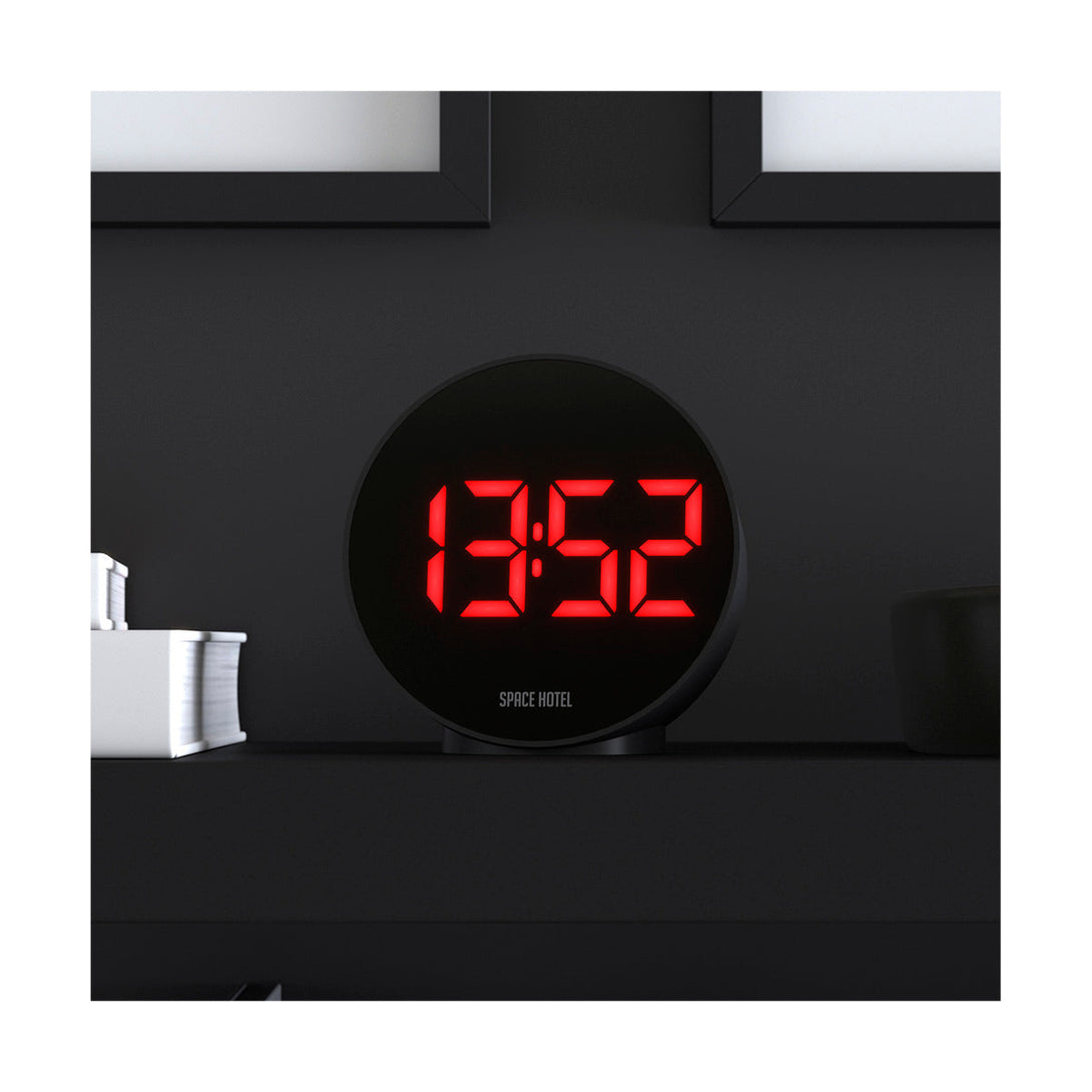 Spherotron LED alarm clock by Space Hotel with a black case and red digital numbers - Cropped