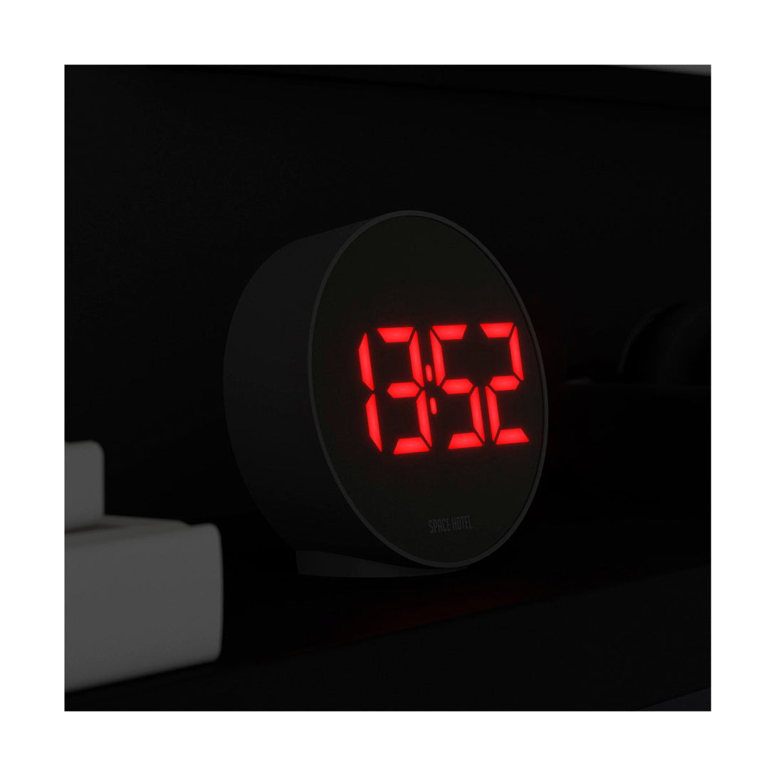 Spherotron LED alarm clock by Space Hotel with a black case and red digital numbers - LED on