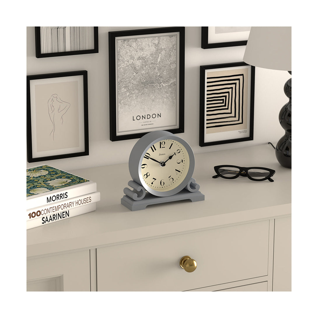Skew Style Shot - Saloon decorative mantel clock by Jones Clocks in French navy with a modern stylistic Arabic dial and metal spade hands - JSAL192FN