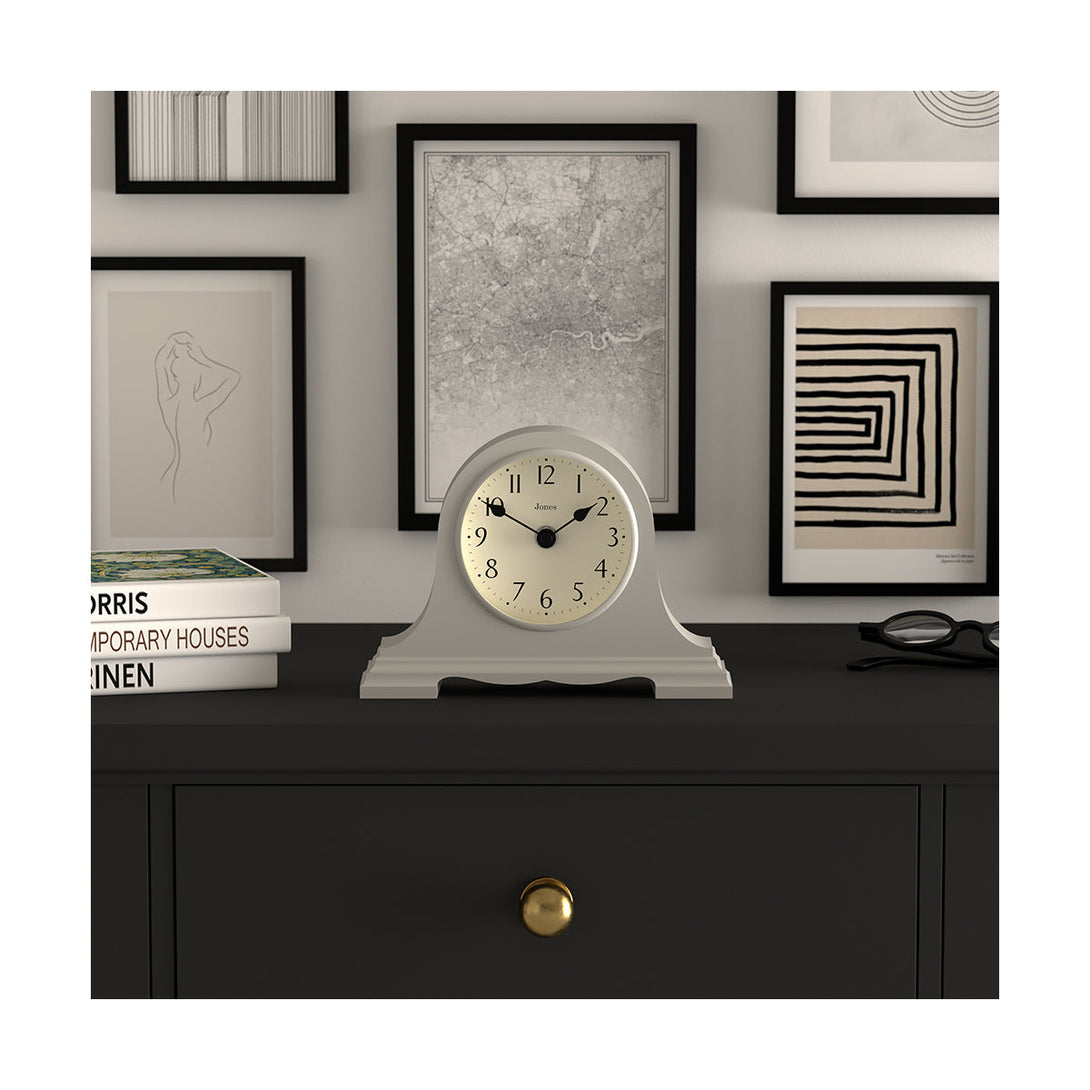 Style Shot 1 - Speakeasy mantel clock by Jones Clocks with a classic, pretty case ina light cloud Grey. Complimented by an elegant dial - JSPEA189OGY
