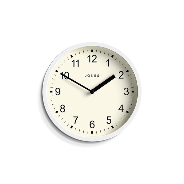 Front - Spin modern wall clock by Jones Clocks. A small and minimalistic white case with a contemporary dial - JSPIN136W