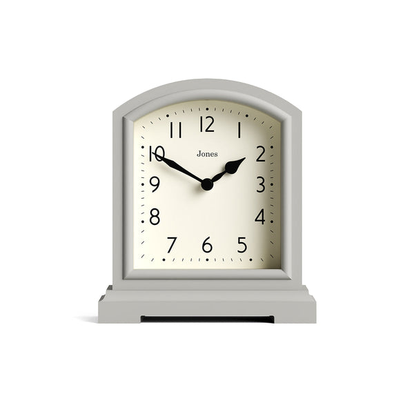 Front - Tavern mantel clock by Jones Clocks. A classic light grey case with an Arabic Numeral dial and black spade hands - JTAV243OGY