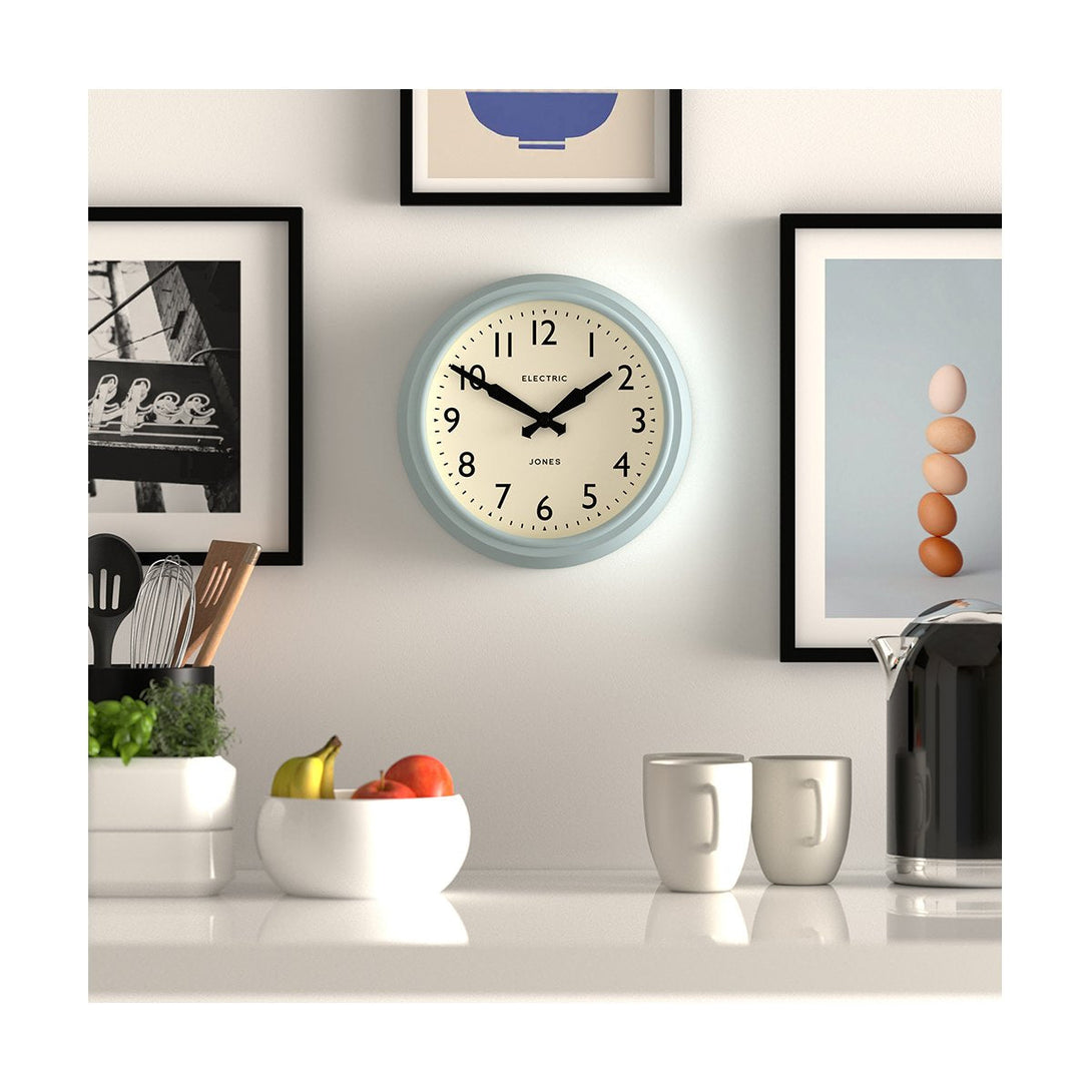 Kitchen - Telecom wall clock by Jones Clocks. A mid-century modern case in light blue, bold Arabic dial, and retro propelling hands - JTCOM27CBL