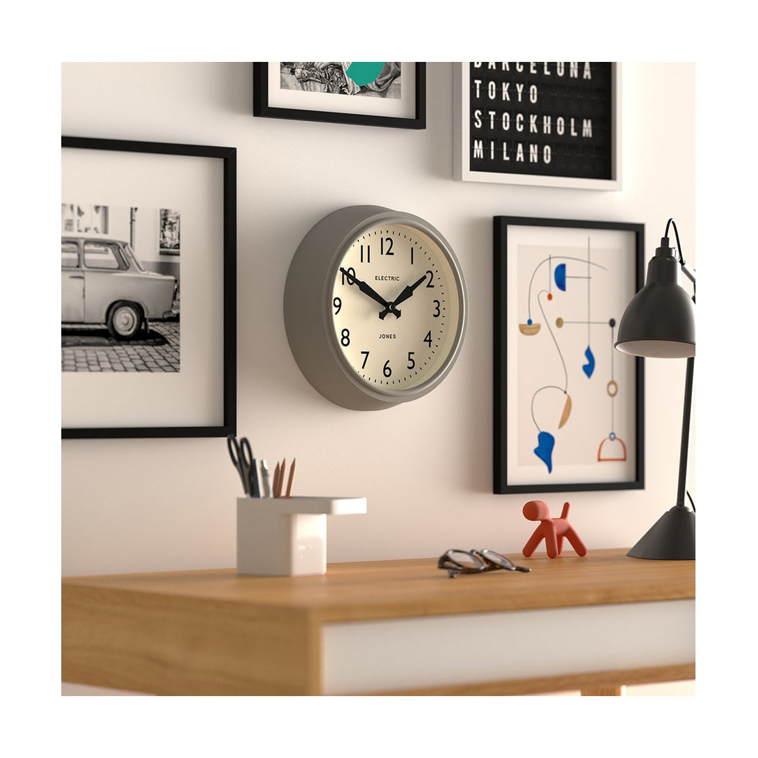 Style Shot Skew - Telecom wall clock by Jones Clocks. A mid-century modern pepper grey case, bold Arabic dial, and retro propelling hands - JTCOM27PGY