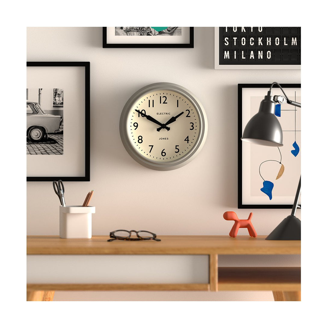 Style Shot - Telecom wall clock by Jones Clocks. A mid-century modern pepper grey case, bold Arabic dial, and retro propelling hands - JTCOM27PGY