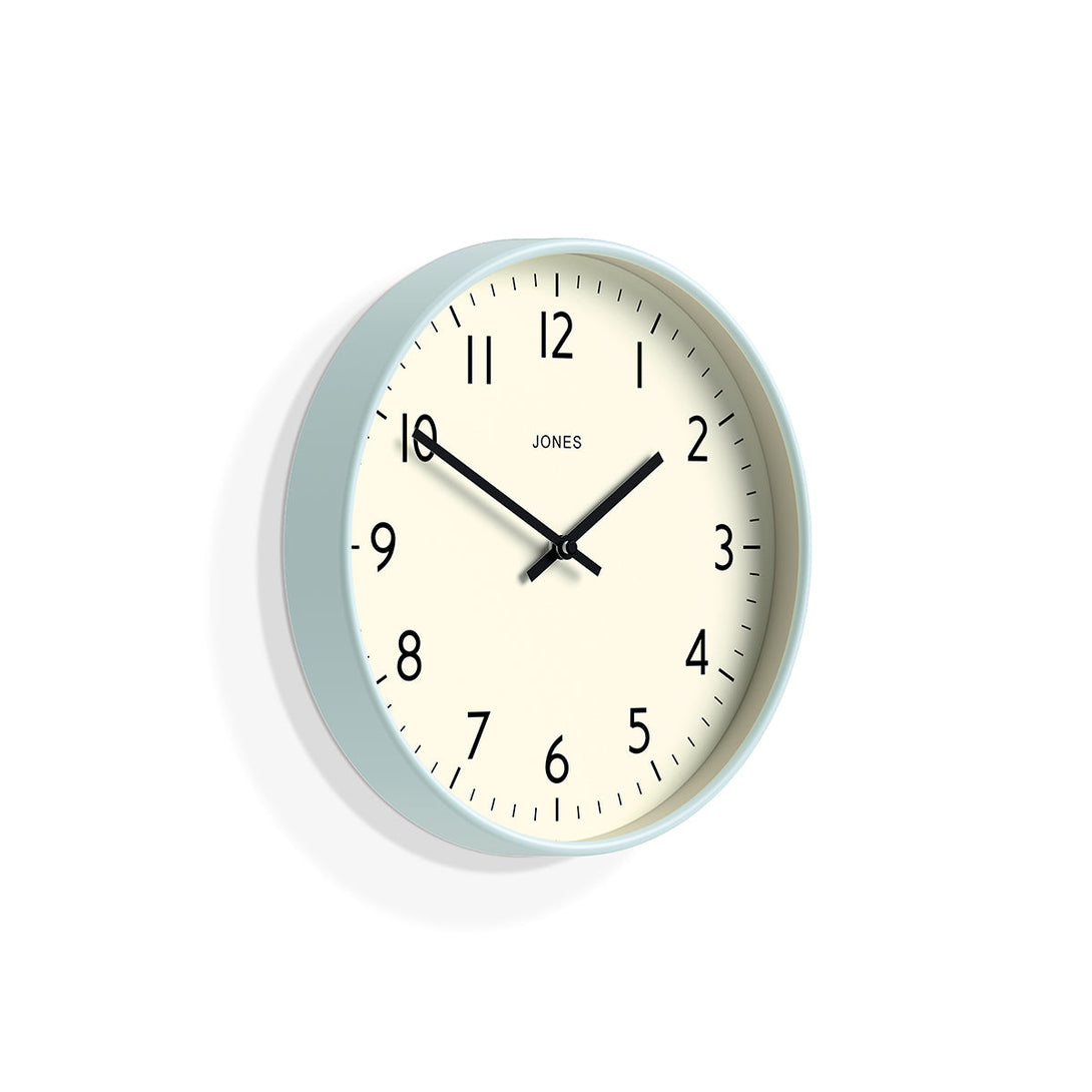 Skew - Studio wall clock by Jones Clocks in pale blue with an easy-to-read and minimalistic dial - JPEN52CBL