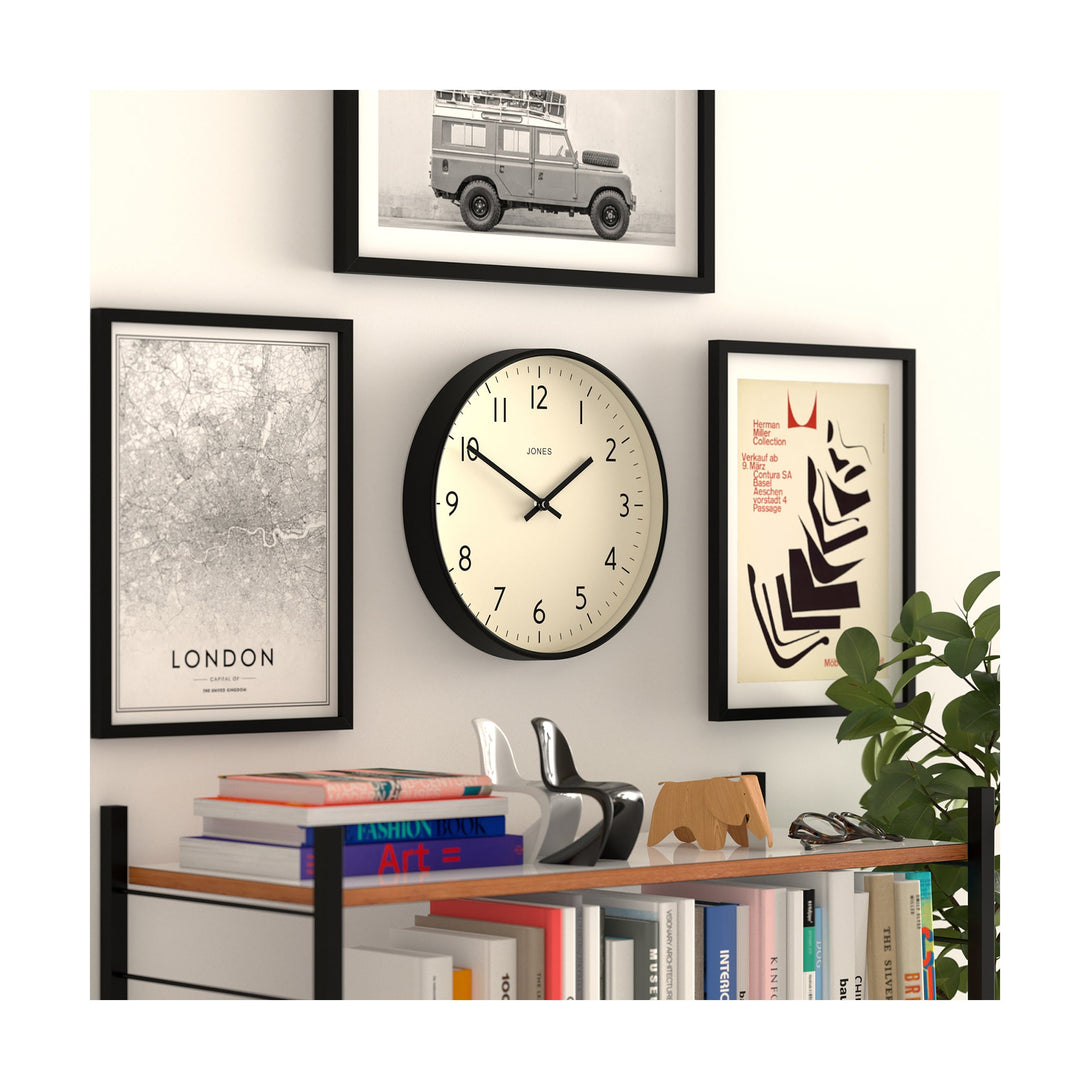 Skew style shot - Studio wall clock by Jones Clocks in black with an easy-to-read and minimalistic dial - JPEN52K