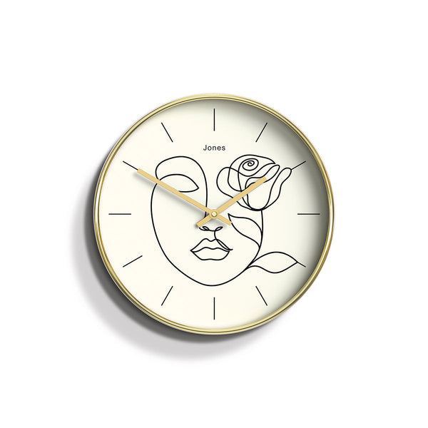 Front - Serena wall clock by Jones Clocks. An illustrative face on a decorative cream dial with gold hands, inside a 'gold effect' case - JTIG210PB