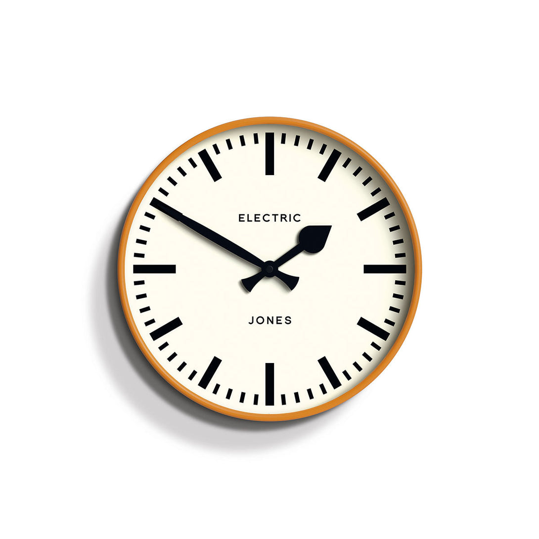 Front - Tiger wall clock by Jones Clocks. A contemporary 'fizzy' orange case paired with a bold black railway dial and spade / baton black hands - JTIG38FO