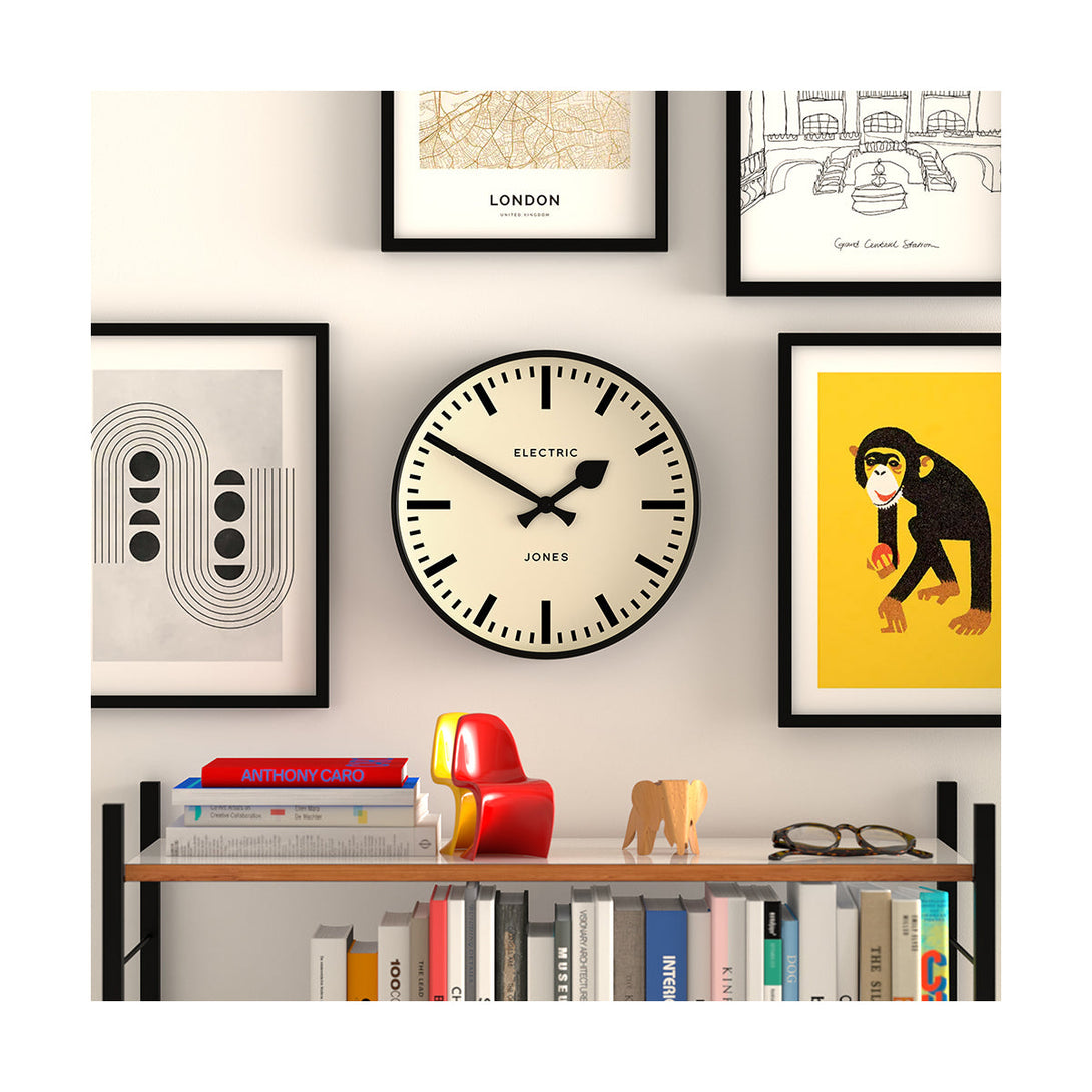 Styles shot - Tiger wall clock by Jones Clocks. A contemporary black case paired with a bold black railway dial and spade / baton black hands - JTIG38K