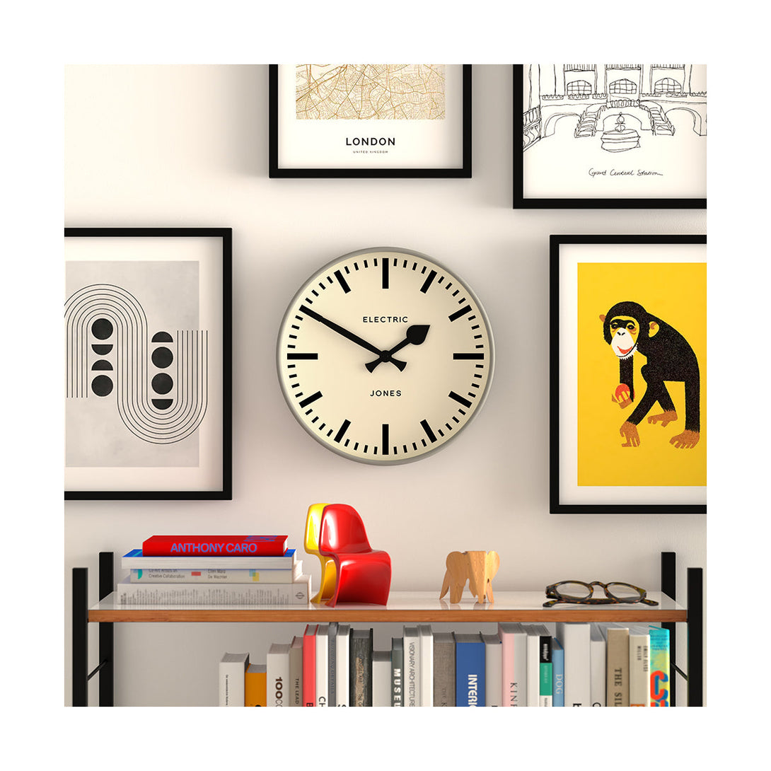 Style shot - Tiger wall clock by Jones Clocks. A contemporary grey case paired with a bold black railway dial and spade / baton black hands - JTIG38PGY