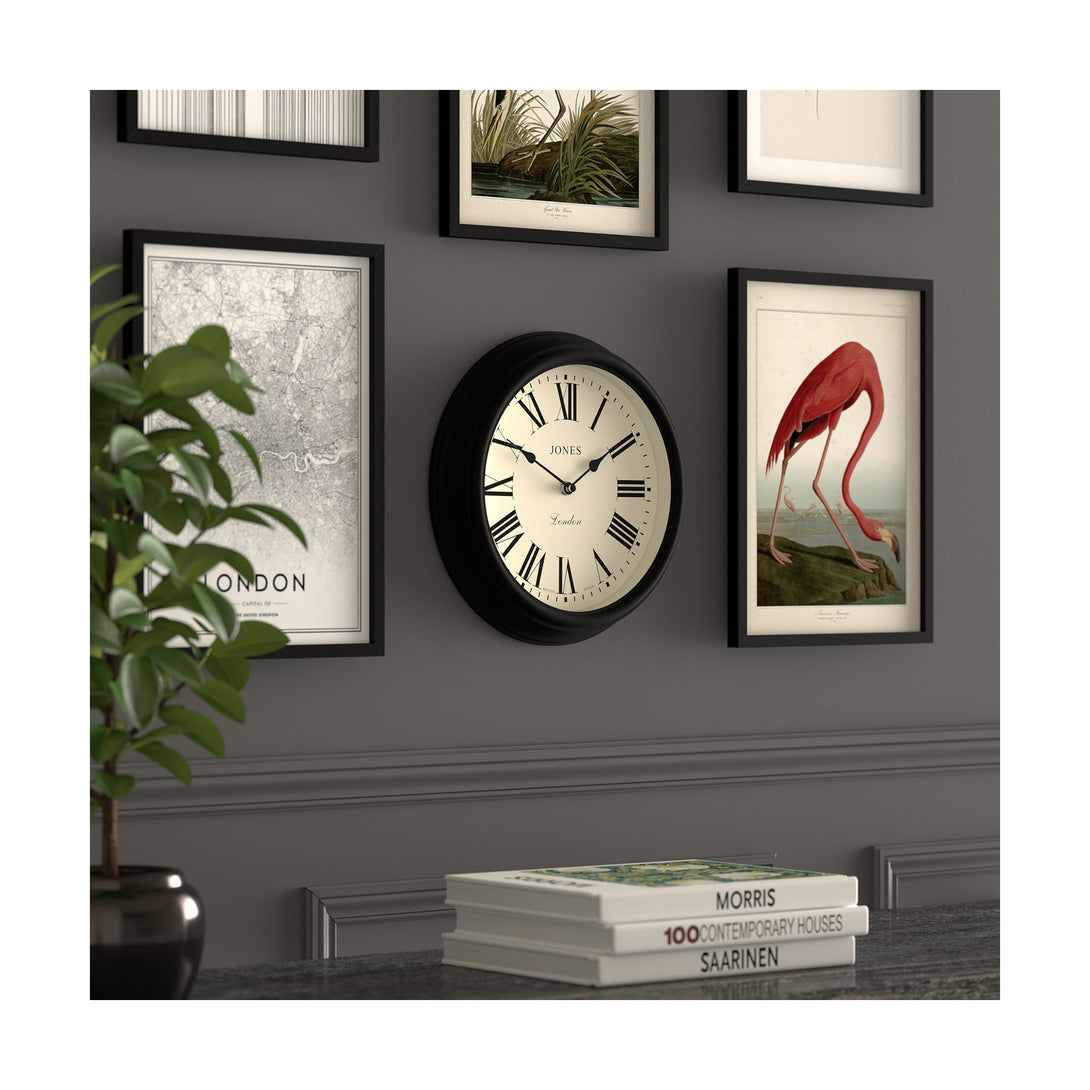 Gallery wall skew - Venetian wall clock by Jones Clocks. A classic Roman numeral dial with traditional spade hands, inside a decorative black case - JVEN319K
